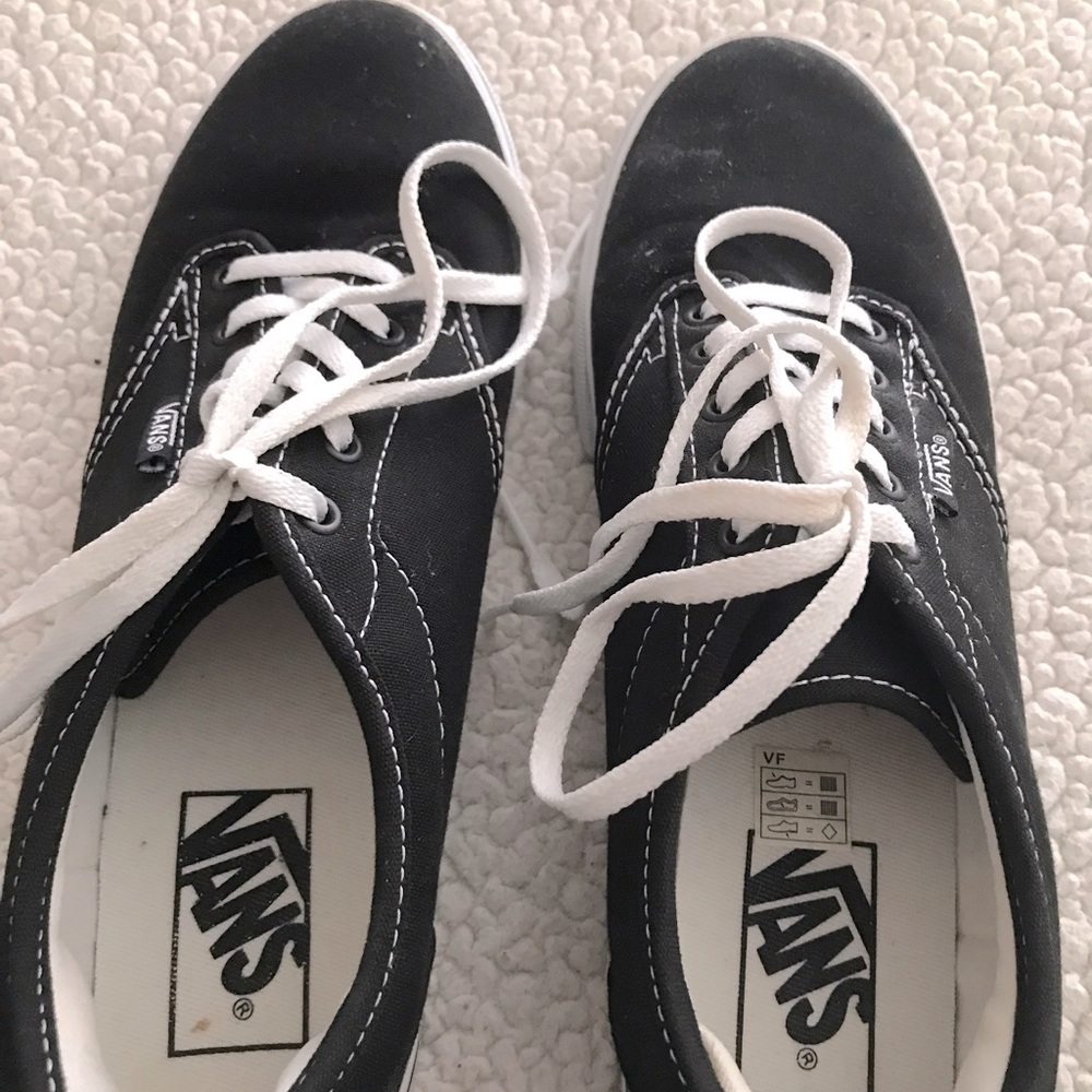 Black lace up VANS.